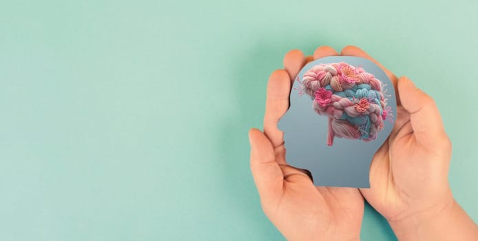 Human brain with flowers, self care and mental health concept, positive thinking, creative mind, knitted with wool
