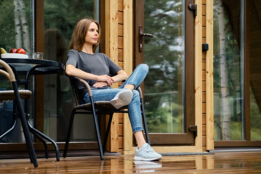 A lovely young woman is resting in silence in her country house