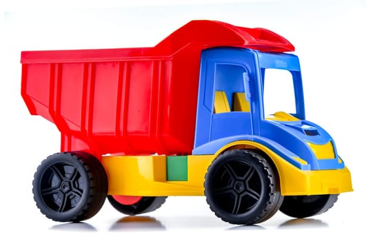 Colorful plastic dump truck isolated on white background.