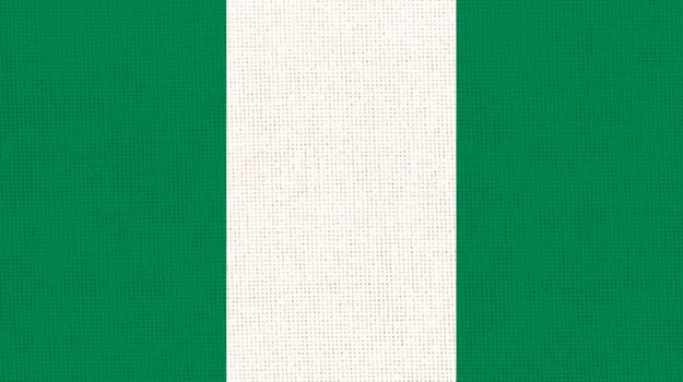 Flag of Nigeria. Nigerian flag on fabric surface. Fabric Texture. National symbol. Federal Republic of Nigeria. African country. Nigeria flag illustration