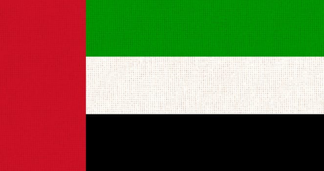 Flag of United Arab Emirates. Emirates flag on fabric surface. Fabric texture. National symbol of United Arab Emirates. Arabian Peninsula. Asian country