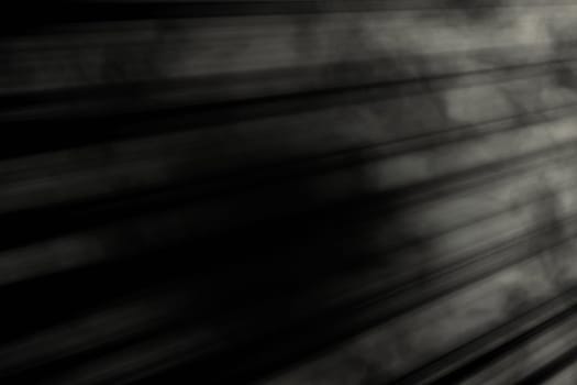 Gray-white horizontal light on the right side on a black background
