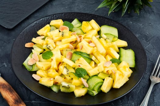 Vegan exotic juicy pineapple, ananas cucumber salad. Healthy, balanced, diet food.