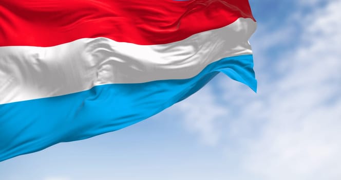 Close-up of Luxembourg national flag waving in the wind on a clear day. Luxembourg became a member of the EU in January 1958. 3d illustration render. Fluttering textile