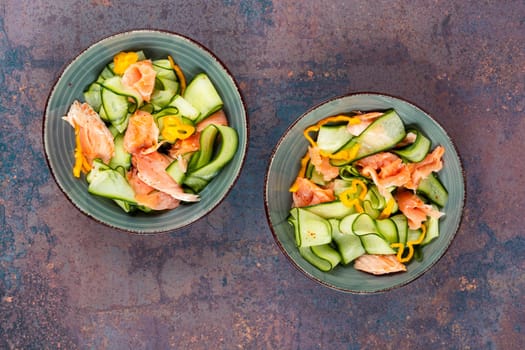 Salmon salad food, salmon fillet with fresh cucumber. Asian cuisine.