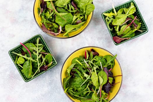 Green vegan salad made from mixed green leaves. Green food. Top view.