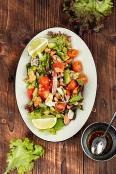 Mix salad with seafood, shrimp, scallop, octopus, squid and fresh vegetables.