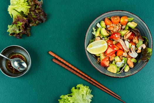 Mix salad with seafood, shrimp, scallop, octopus, squid and fresh vegetables.