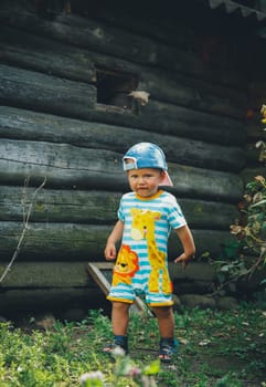 A little boy on the street on a summer day