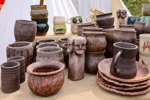 Cracow, Poland - April 11, 2023: Handmade imitations of medieval ceramic vessels in knight camp at the festival of historical reconstruction