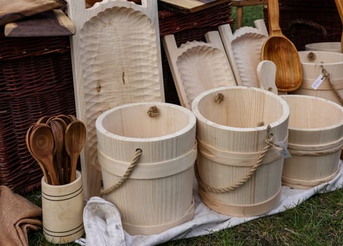 Cracow, Poland - April 11, 2023: Imitations of old wooden vessels in knight camp at the festival of historical reconstruction