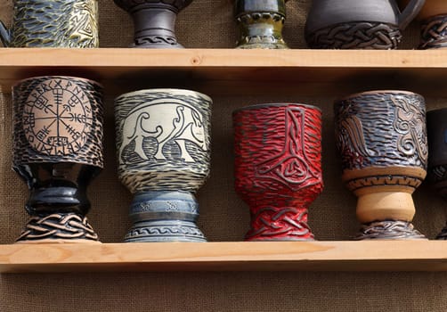 Cracow, Poland - April 11, 2023: Handmade imitations of medieval ceramic vessels in knight camp at the festival of historical reconstruction