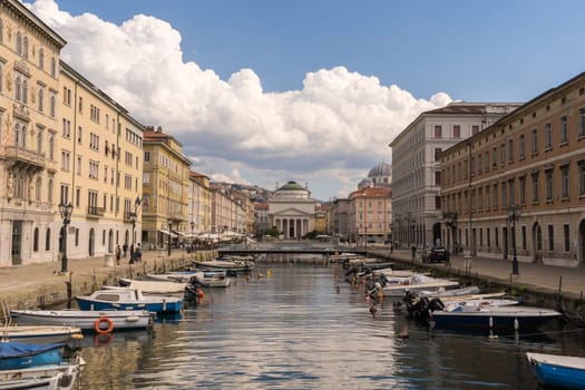 A view along the Canal Grande over Ponte Rosso  to the Sant'Antonio Nuovo Church in Trieste in Northern Italy