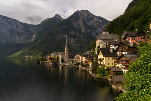 The World Heritage Town of Hallstatt, that seems to be built in the rocks, shines in the early morning sun.