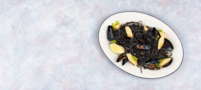 Vegan black bean pasta with boiled mussels. Spaghetti with seafood. Pasta vongole.