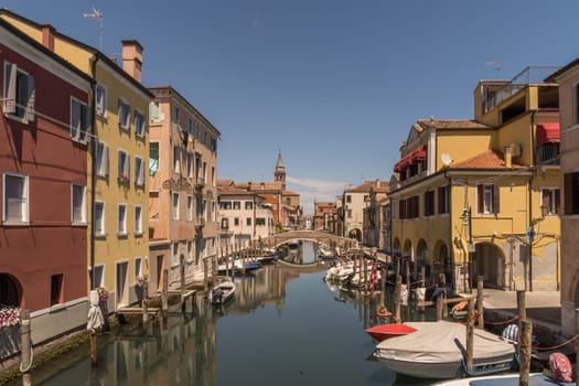 Chioggia, Italy - July 10th, 2022: View over the old town along one of the canal of the pleasant medieval city of Chioggia.