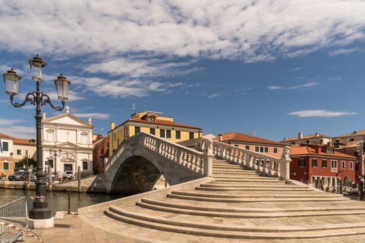 View of the Ponte di Vigo in Chioggia, stretching over the main canal at it's end - a relative to the famous Ponte Rialto of Venice.