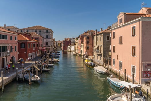 Chioggia, Italy - July 10th, 2022: View over the old town along one of the canal of the pleasant medieval city of Chioggia.