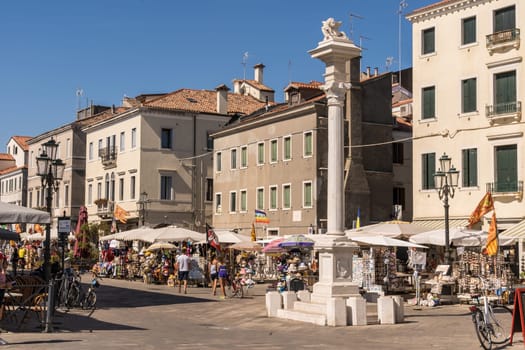 Chioggia, Italy - July 10th, 2022: Daily life on one of the main walking areas in the pleasant old town of Chioggia.