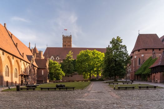 The courtyard of the worlds largest castle by area, the medieval Malbork Castle in Poland.