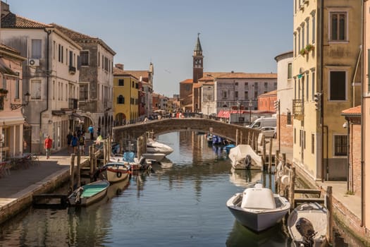 Chioggia, Italy - July 10th, 2022: View over the old town along one of the canal of the pleasant medieval city of Chioggia.