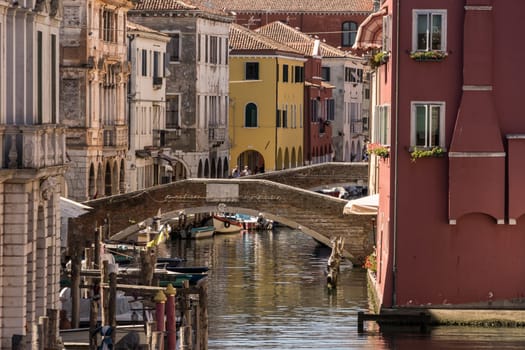 Chioggia, Italy - July 10th, 2022: View over the old town along one of the canal of the pleasant medieval city of Chioggia.