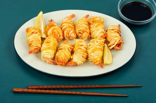 Fried rolled potato shrimps, prawns and potato rolls. Popular Asian food. Vietnamese cuisine.