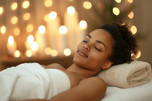 Beautiful african american young woman getting massage in spa salon . Relaxed woman with closed eyes enjoying a spa day with warm lighting.