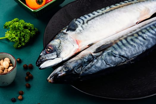 Raw, fresh mackerels or scomber and ingredients for cooking. Raw fish, seafood concept.