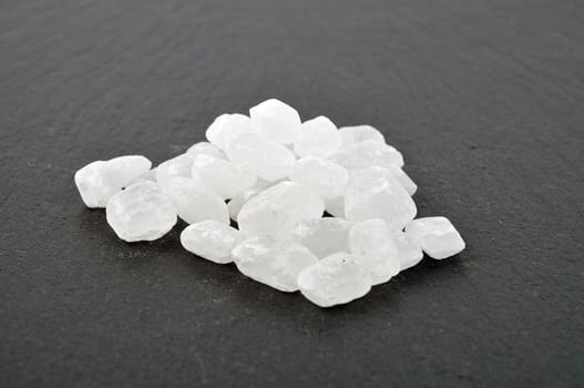 Several rock candy on dark background