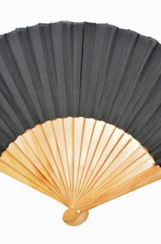 Detail of a hand held fan out of bamboo on a white background