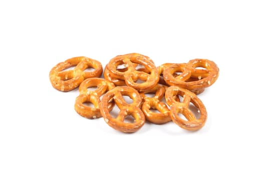 Hearty salty pretzels as a snack on a white background