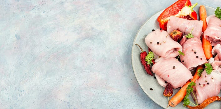 Fresh, uncooked pork meat rolls. Raw meat. Pork loin.
