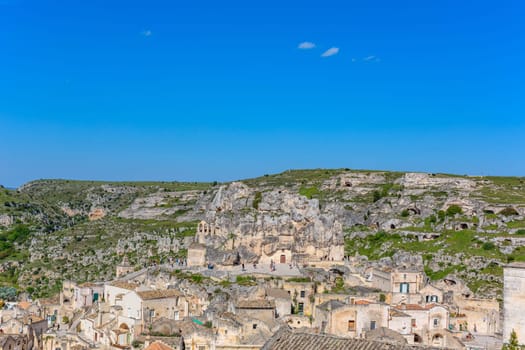 Matera, Italy - 6 May 2023: Old town of Matera (Sassi di Matera), Basilicata, southern Italy. Prehistoric cave dwellings