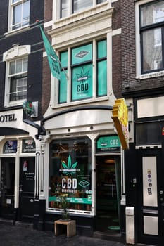 Amsterdam, Netherlands - April 21, 2023: One of the many coffee shops in De Wallen - called the red light district famous for its entertainment character