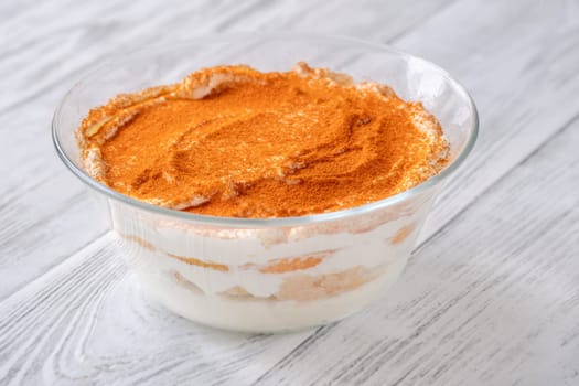 Bowl of mandarin orange tiramisu on the table