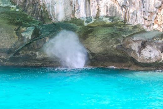 Splashes of waves on the rocks in Phuket.