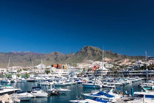 Costa Adeje, Tenerife, Spain - July 28, 2013: The islands of Tenerife is a resort for tourists. Coast of the sea and hotels on the beach.