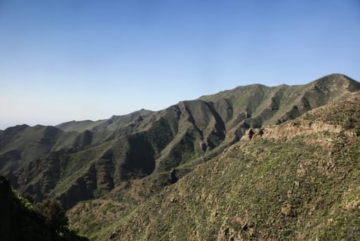 Mountain landscape of Tenerife. Volcanic island. Hills and valleys.