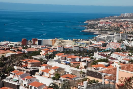Costa Adeje, Tenerife, Spain - July 28, 2013: The islands of Tenerife is a resort for tourists. Coast of the sea and hotels on the beach.