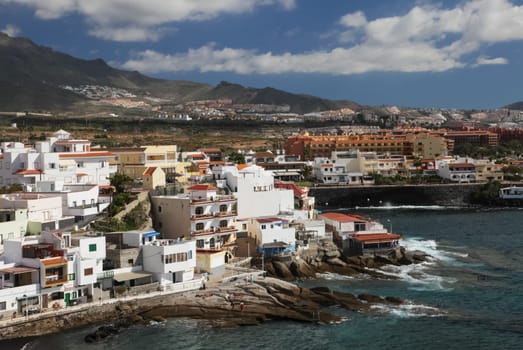 Costa Adeje, Tenerife, Spain - July 28, 2013: The islands of Tenerife is a resort for tourists. Coast of the sea and hotels on the beach.