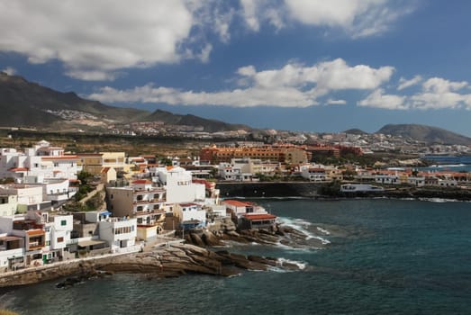 Costa Adeje, Tenerife, Spain - July 28, 2013: The islands of Tenerife is a resort for tourists. Coast of the sea and hotels on the beach.