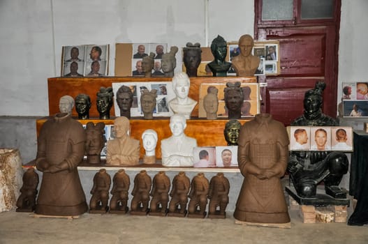 XIAN, CHINA - October 29, 2017: Clay busts in the museum. Souvenir workshop of the terracotta army. Souvenirs in the museum of the terracotta army.