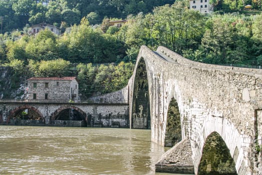 Bridge of the Devil or Ponte della Maddalena historic landmark in Garfagnana. Serchio river. Borgo a Mozzano, Lucca. Tuscany, Italy