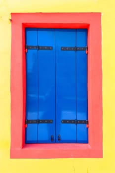 colorful facade of an old fisher house in the village of Burano near Venice