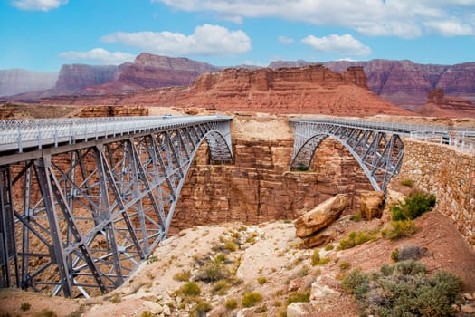 old and new Navajo Bridge spanning the  Colorado at Marble Canyon