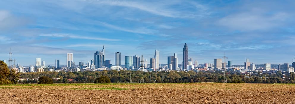 view to skyline of Frankfurt with plowed fields in foreground