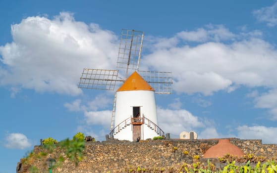 Windmill in tropical cactus garden in Guatiza village, popular attraction in Lanzarote, Canary islands
