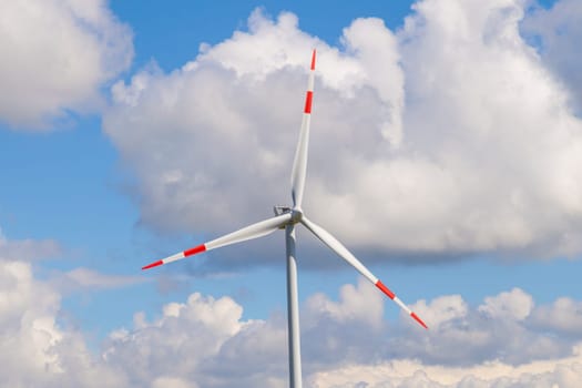 wind turbine generating electricity on blue sky