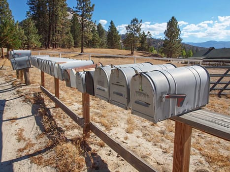 many home mailboxes at the street in USA